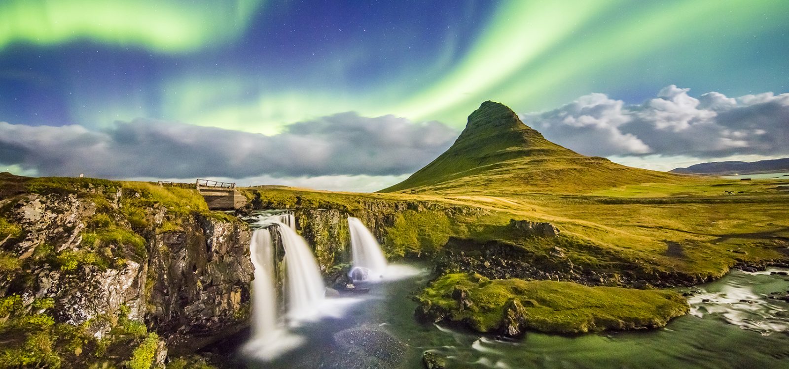 Aurora over Kirkjufell and waterfall at night