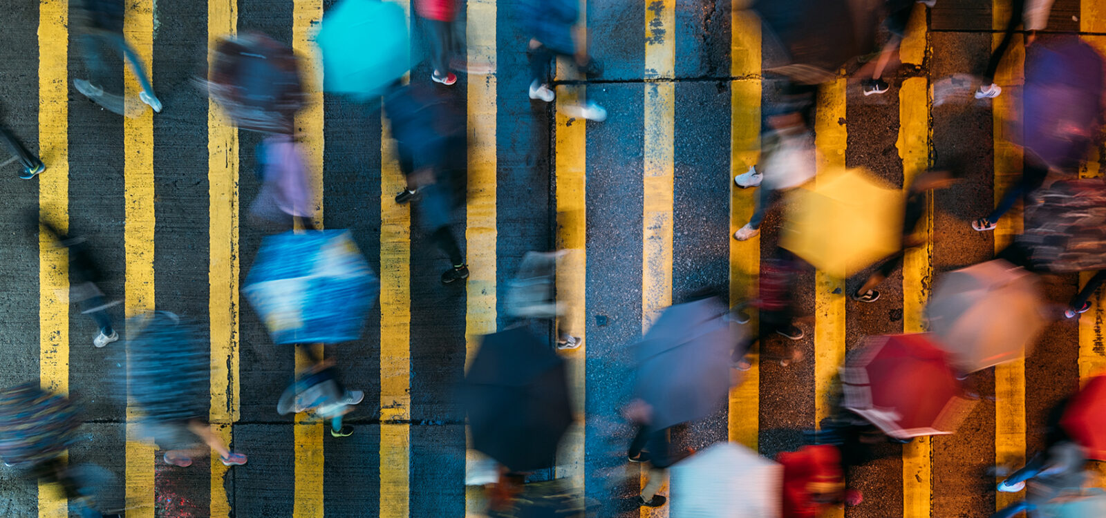 Top view of people crossing a very busy crossroads in Mong Kok district Hong Kong in China