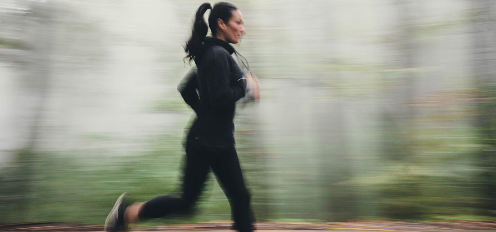 Jogging in blurred motion at foggy forest!