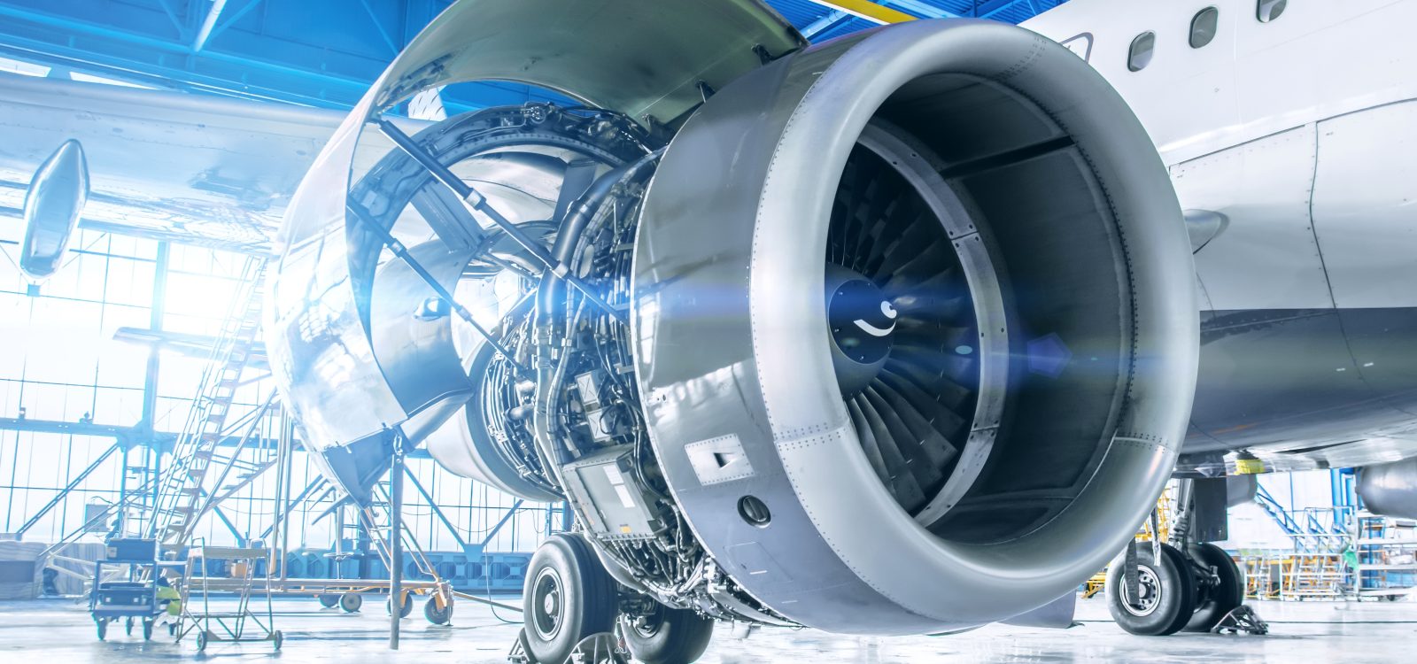 Industrial theme view. Repair and maintenance of aircraft engine on the wing of the aircraft.