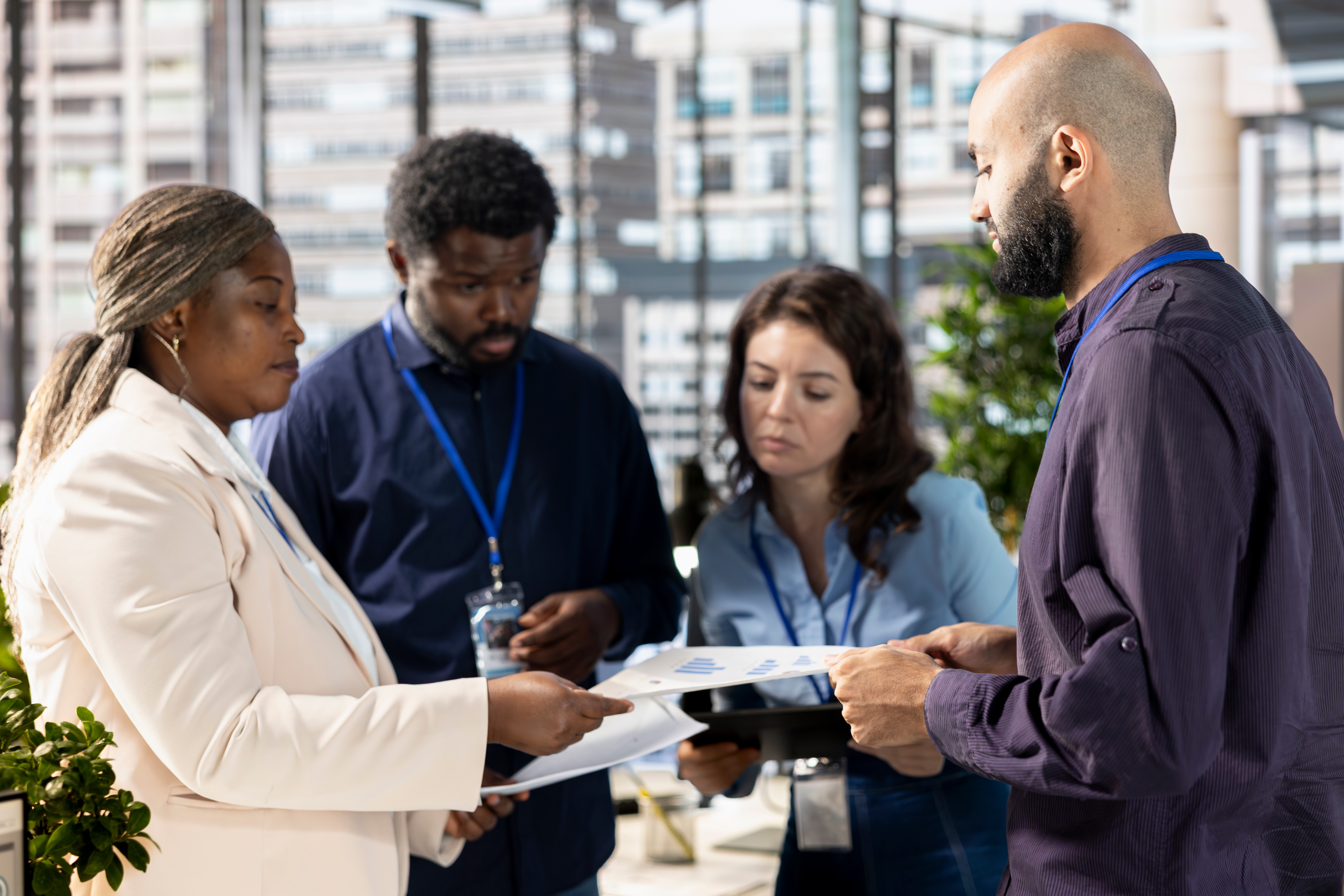 Multiethnic executive team meeting to discuss and look over administrative tasks