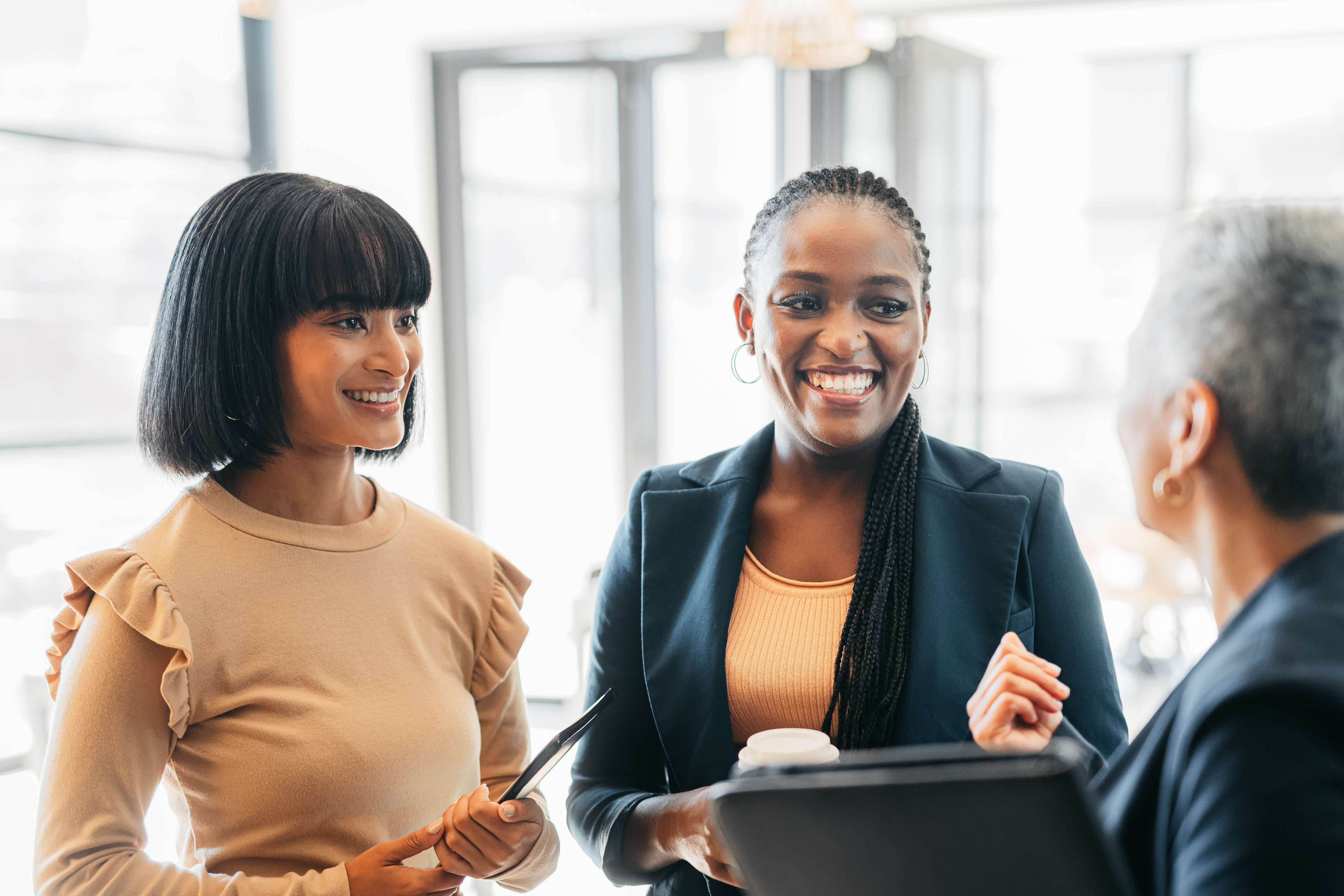 Business women meeting, funny communicatIon and planning strategy for corporate company, collaboration for success at work and comic discussion at office. Employees happy in conversation at job